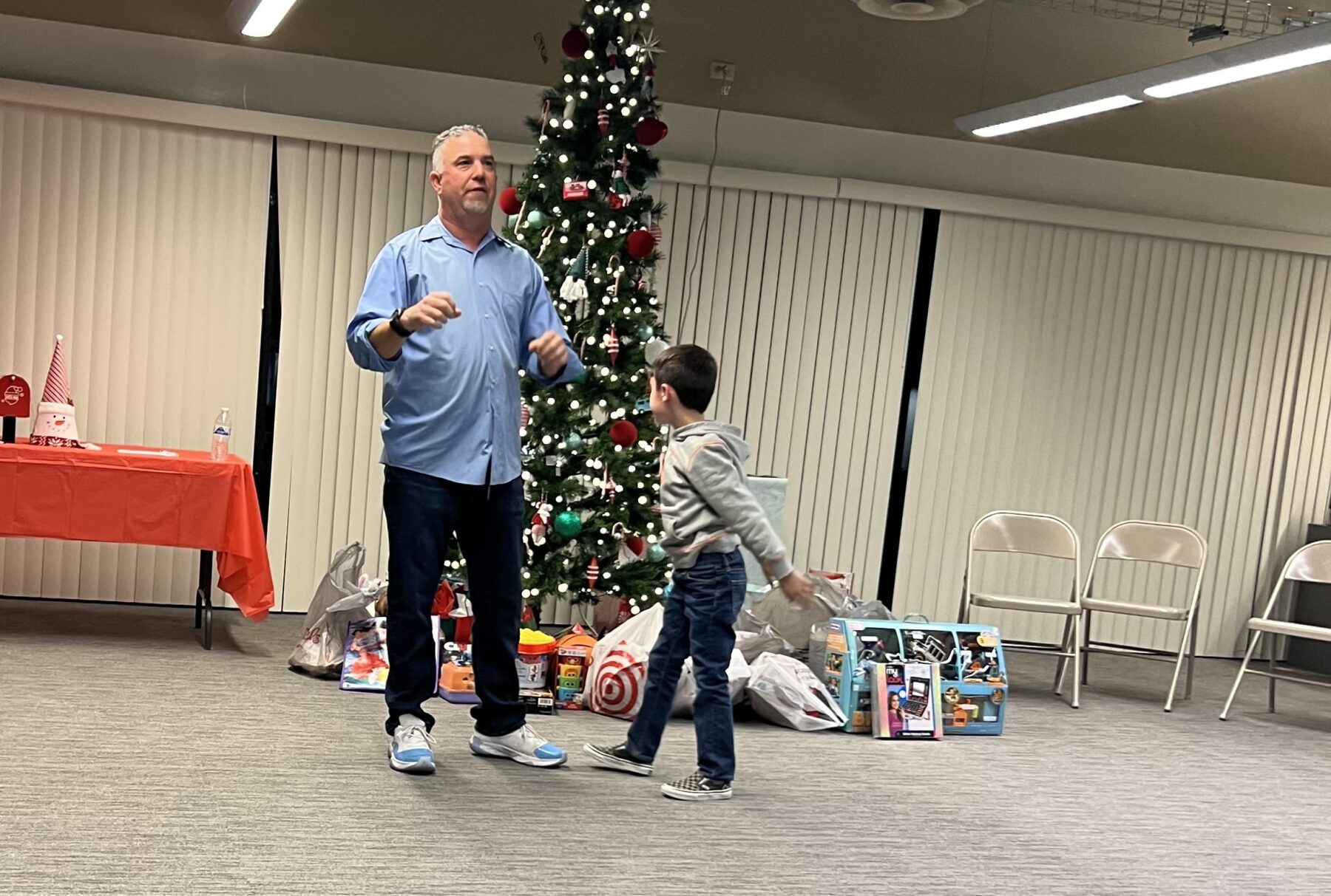 Paul and a young constituent at a Chrismas Party